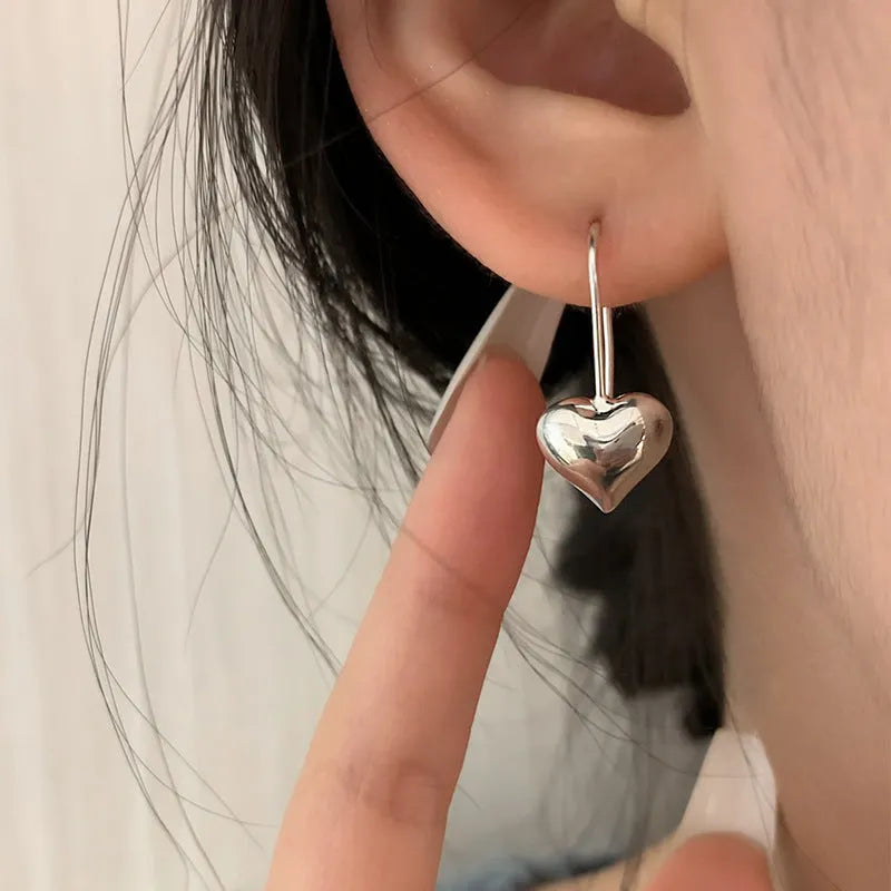 Silver heart-shaped earrings with Korean style design and glossy finish