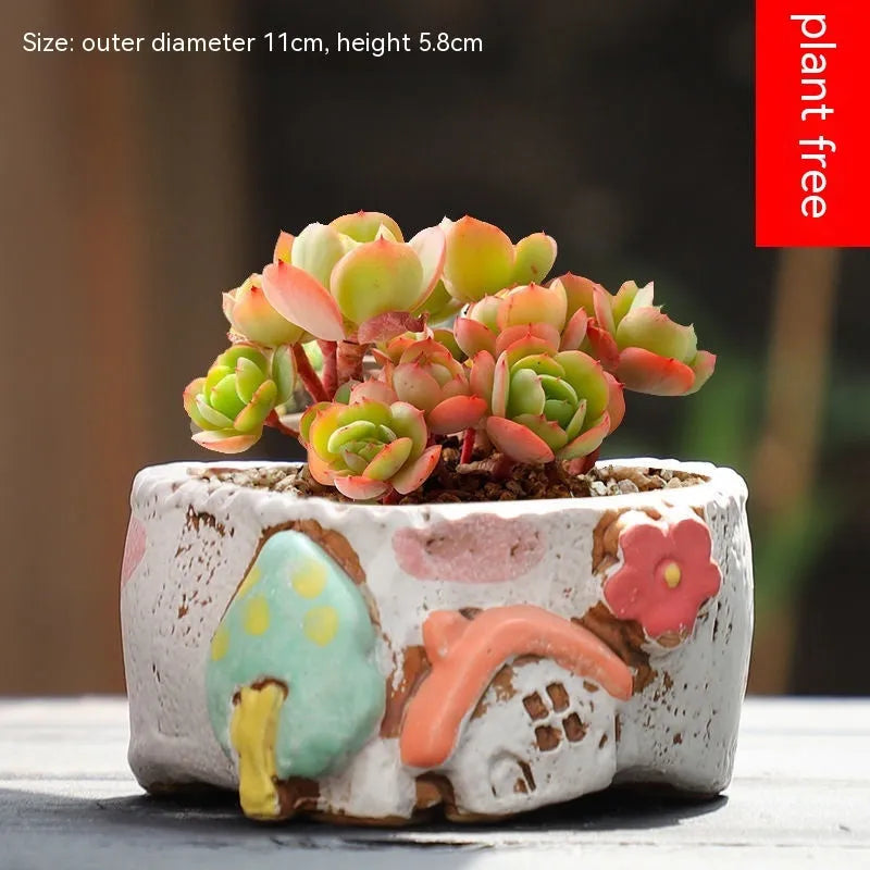 Large calibre ceramic flower pot with hand-painted cute pastoral design on a white background.