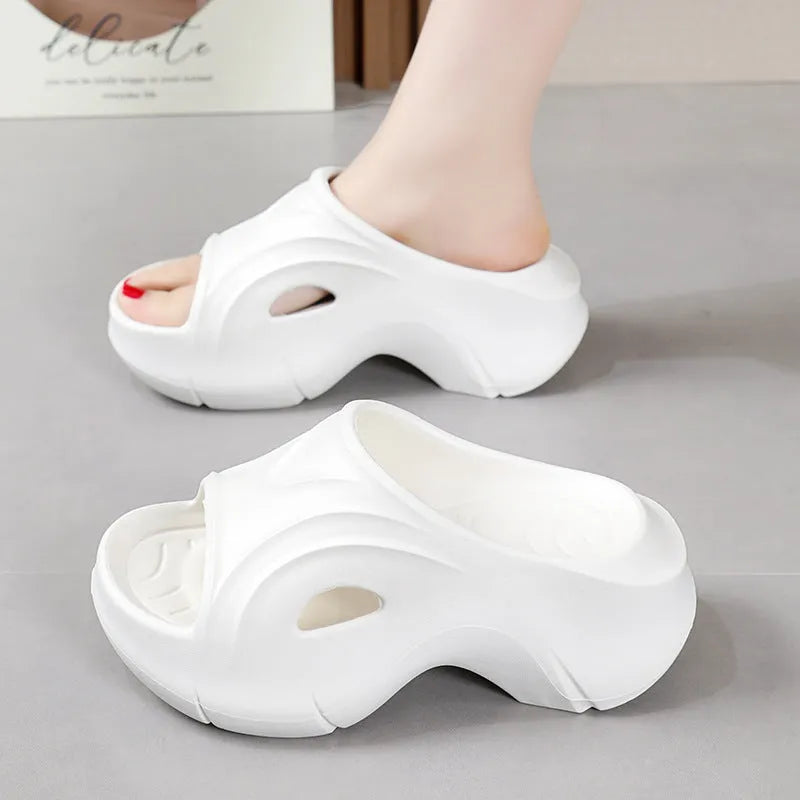 Women's thick-soled EVA foam slippers in white, black, and rose red colours with round toe design