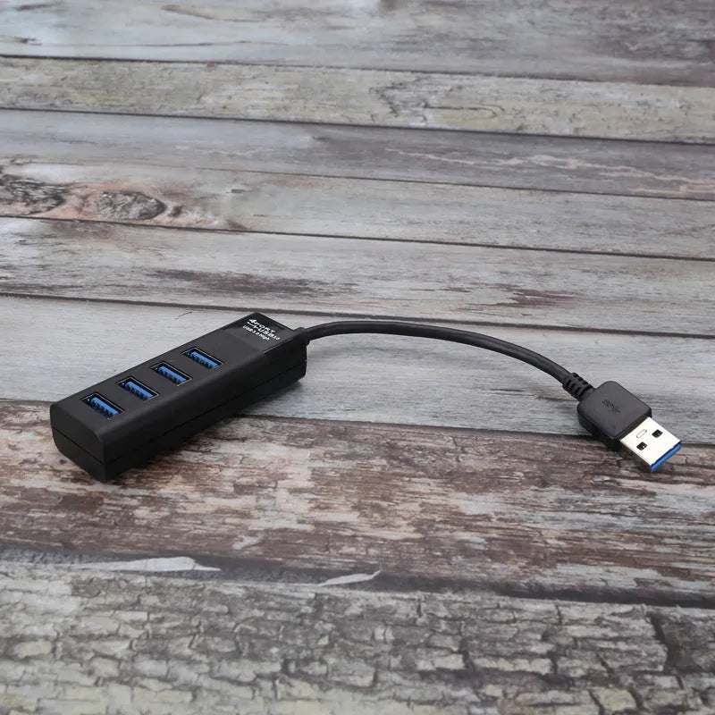 USB 3.0 hub with four ports, blue LED indicators, and 30 cm connection cable