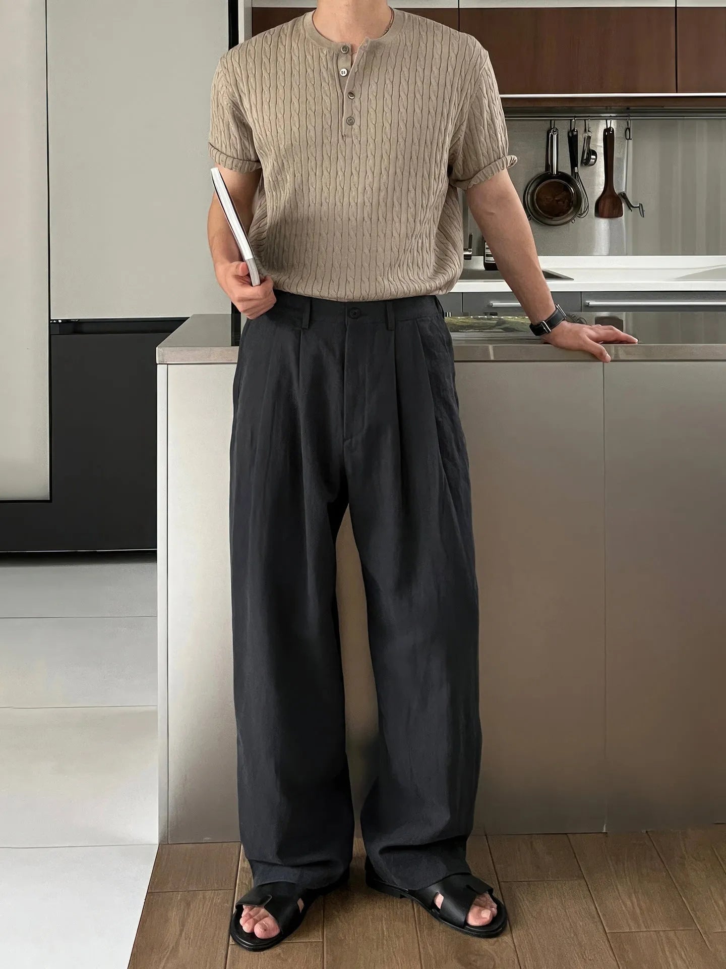 Army green men's casual drawstring waist trousers laid flat, showing the basic style and relaxed fit.