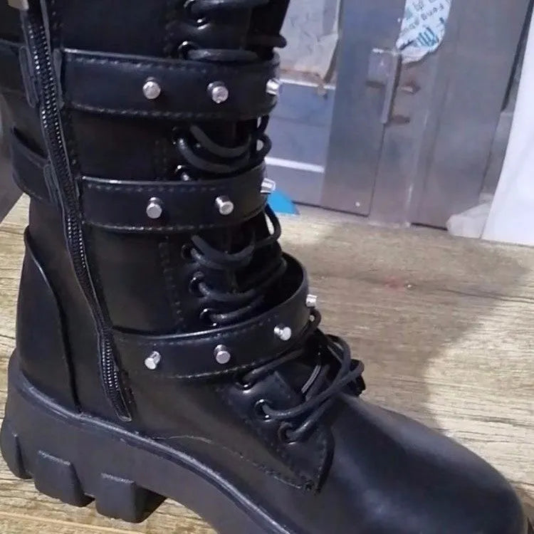 Women's black mid-calf knight boots with large metal buckle and side zip on a white background.