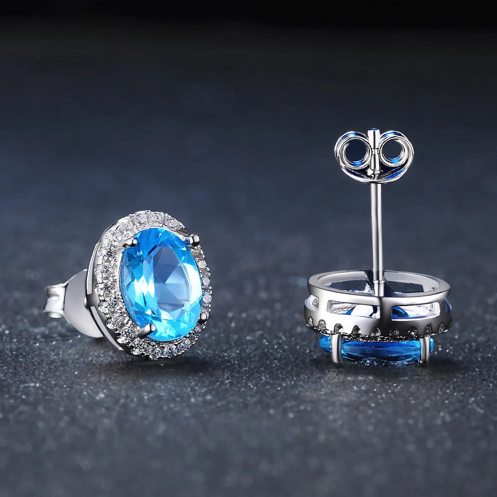 925 sterling silver jewellery set with blue topaz gemstones including earrings, ring, pendant and necklace