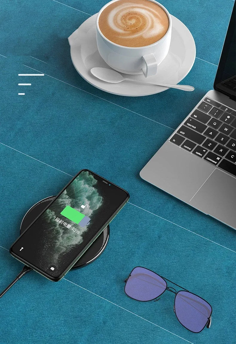 Black Kuulaa wireless disc phone charger with Micro USB cable