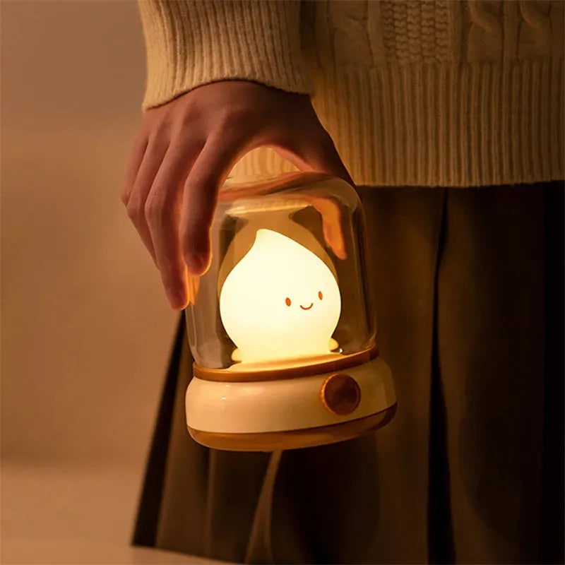 Retro oil lamp style USB rechargeable LED table lamp with dimmable lighting on wooden table