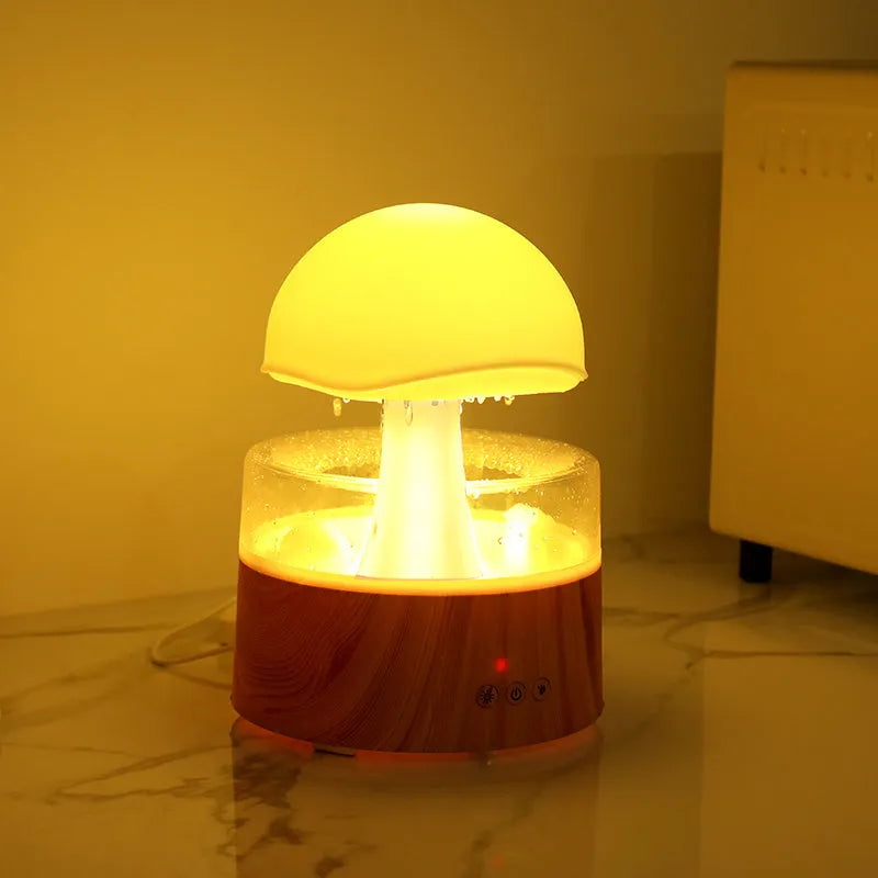 White rain cloud humidifier with falling raindrop effects and LED lighting