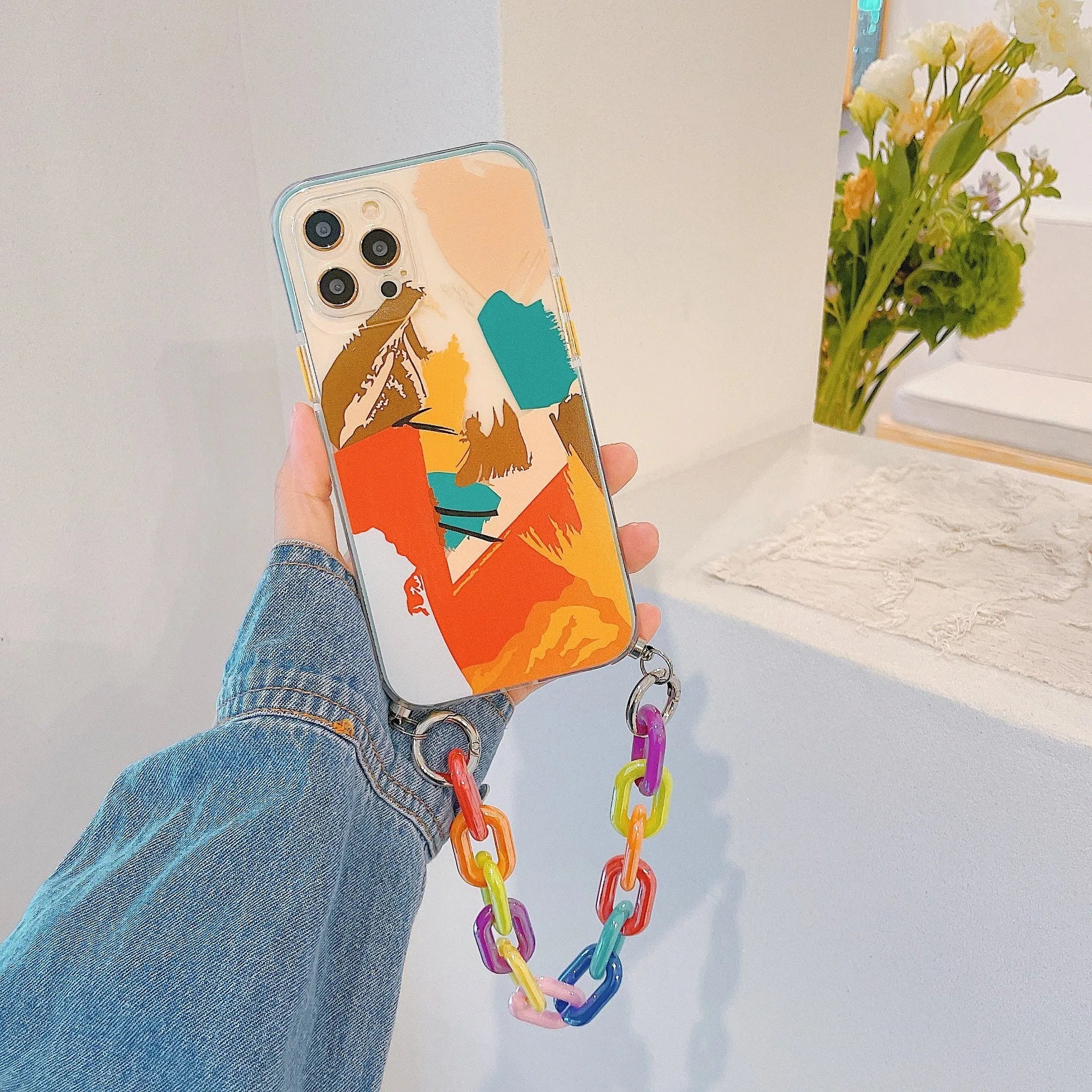 Personalised iPhone case with integrated wrist strap featuring graffiti design in TPU material
