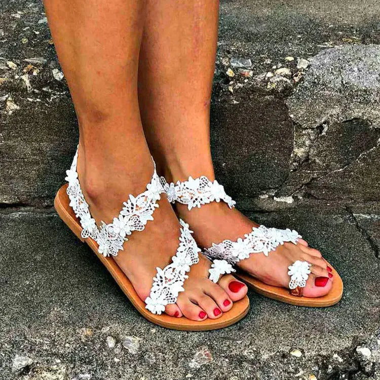 White women's sandals with rhinestone floral decoration and patent leather upper in sizes 35-43