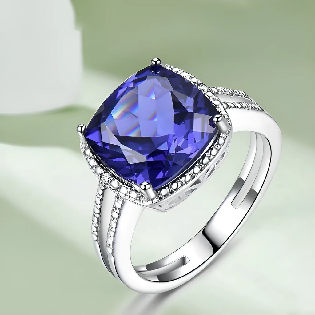 Close-up of a sterling silver ring with a blue tanzanite gemstone.
