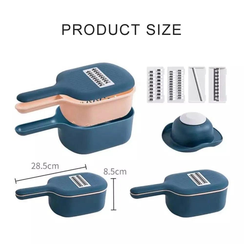 Dark blue vegetable cutter with four stainless steel blades, drain basket, and hand guard on a kitchen counter.