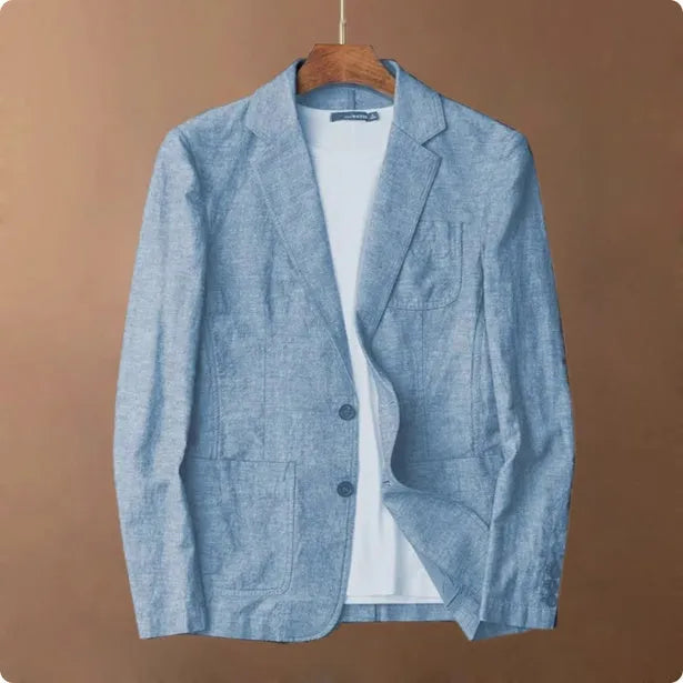 Men's thin linen suit coat in a solid colour on a hanger, showing stick pocket detail.