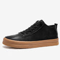 Men's black casual leather shoes with round toe and rubber soles displayed alongside white colour option