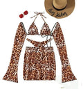 Leopard print women's bikini swimsuit set with halter top and high-waisted skirt bottom