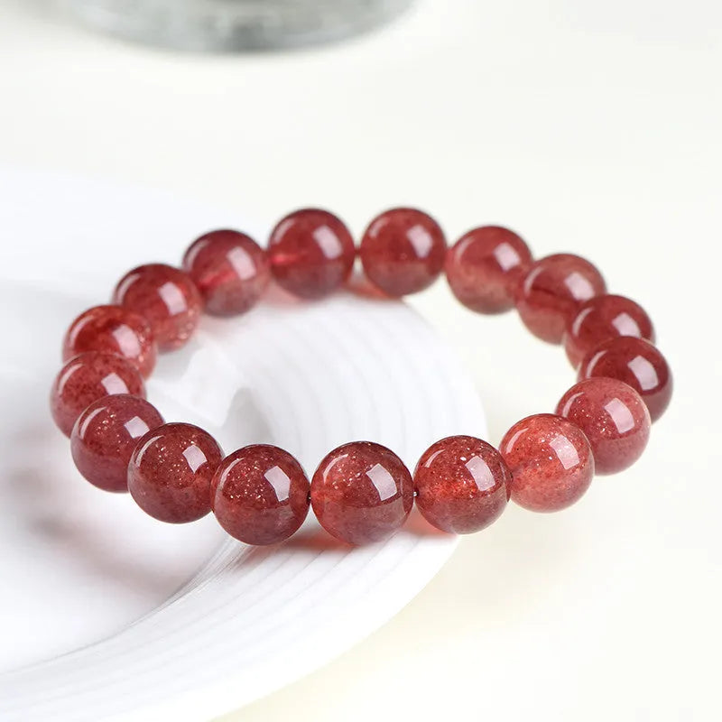 Natural cherry red strawberry quartz bracelet with polished geometry beads and starlight effect