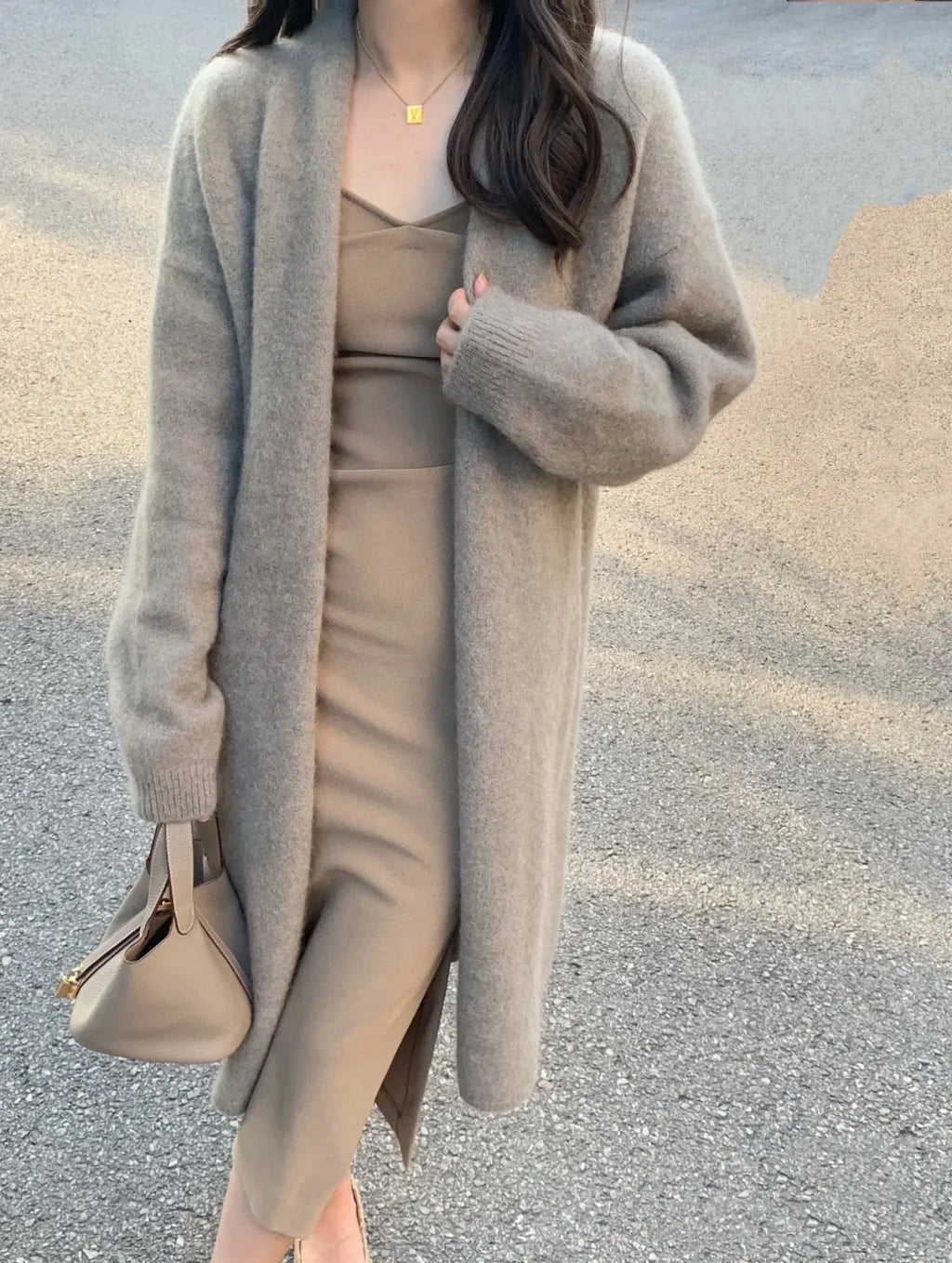 Women's mid-length knitted V-neck cardigan in a loose fit, shown in khaki colour.