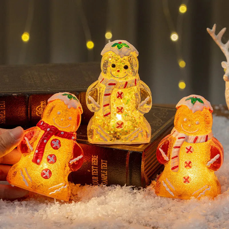 Glowing plastic Christmas ornaments with gingerbread man and snowman designs featuring red, white, and transparent scarves