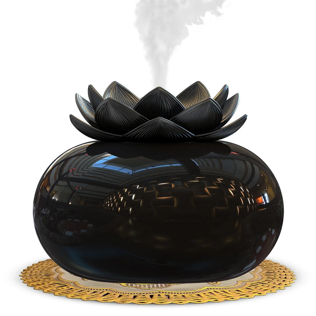 Pure black round ultrasonic aromatherapy humidifier with USB cable for power.
