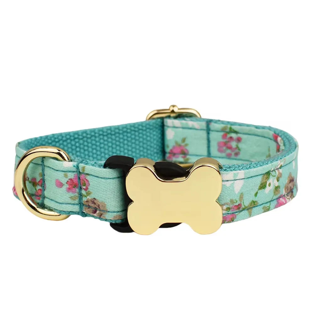 Flat printed grid nylon dog collar with a white bone-shaped plastic buckle on a green background.