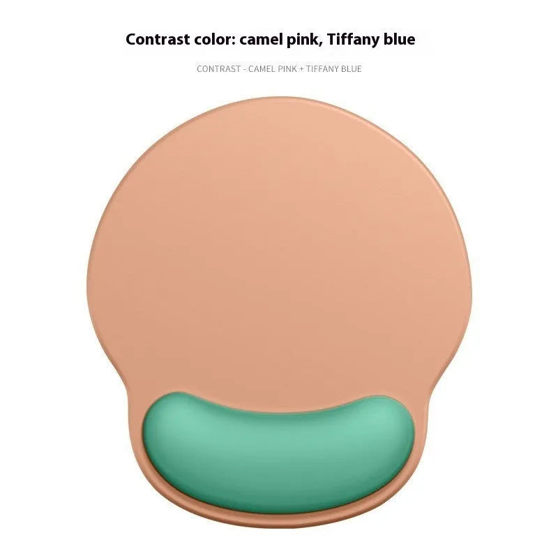 Silicone mouse mat with built-in wrist rest in a gradient colour option on a desk.