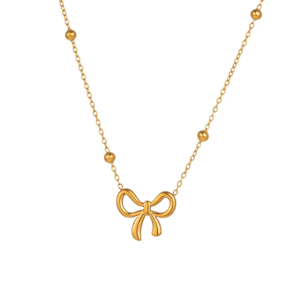 Gold bow necklace on adjustable 41-50cm titanium steel chain with cross link design