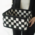 Checkerboard patterned woven felt folding storage basket with handle, showing dimensions 37cm by 29cm by 19.5cm.