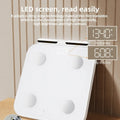 White tempered glass body fat scale with 8 electrodes and LED display showing weight measurement