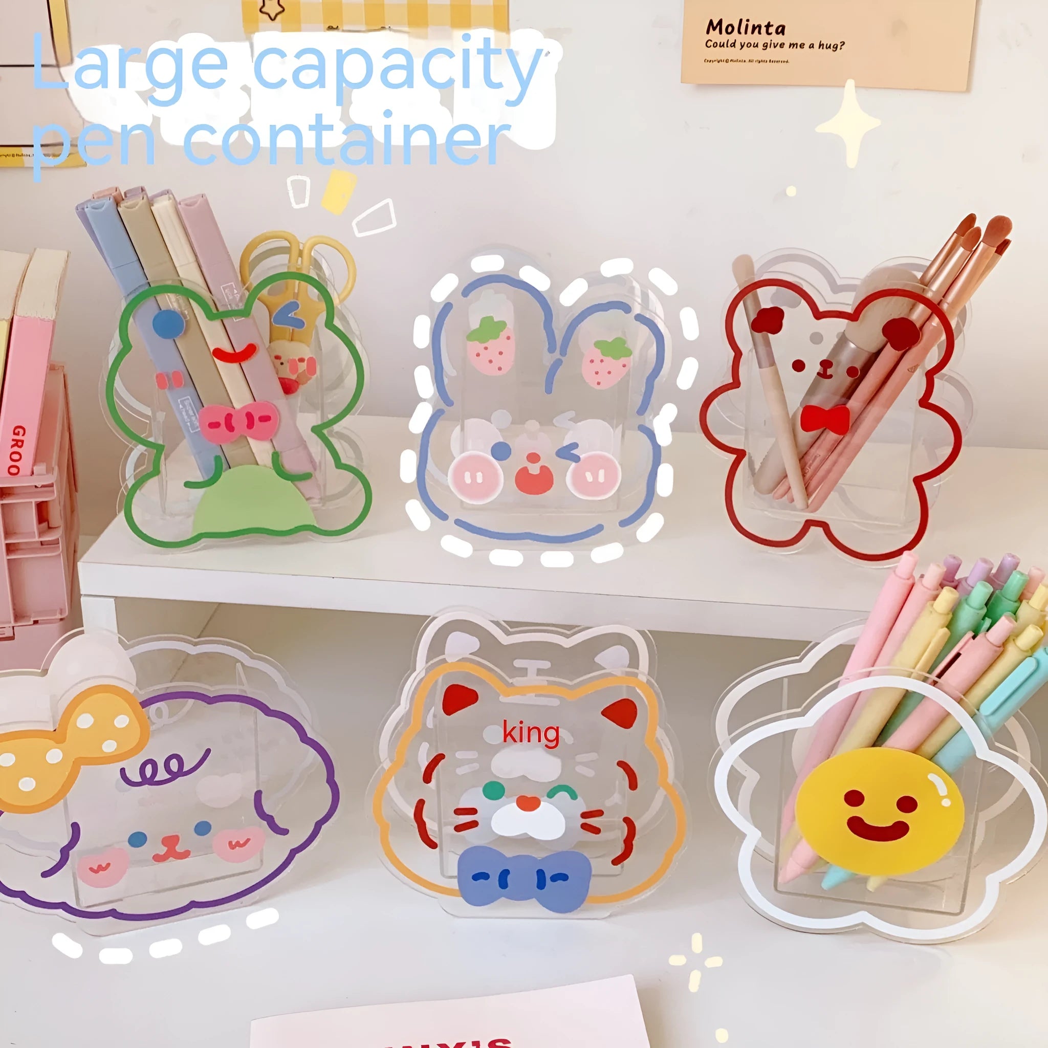 Clear square acrylic storage box with a cute strawberry rabbit character design on a desk.