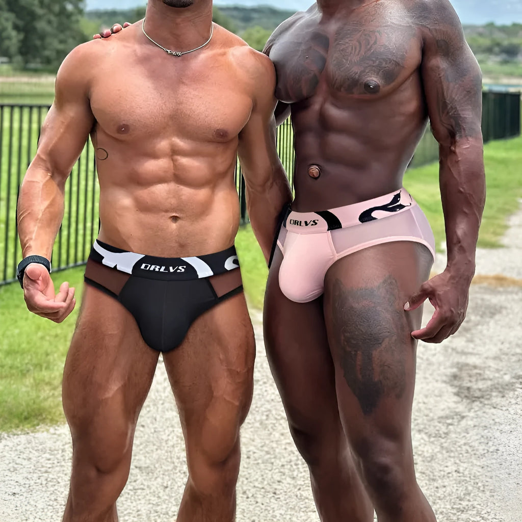 Men's solid colour cotton modal boxer shorts in black, pink, or red on a white background.