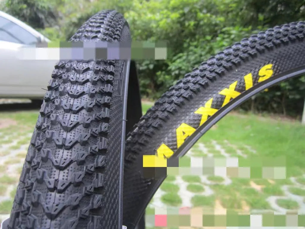 Ultralight puncture-proof mountain bike tyre showing tread and available size options: 26, 27.5, 29 inch.