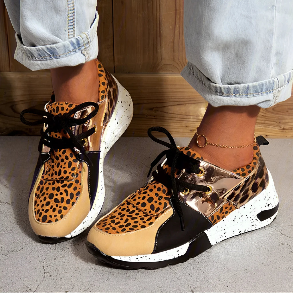 Women's suede casual sneakers with a wedge sole in leopard print colour.