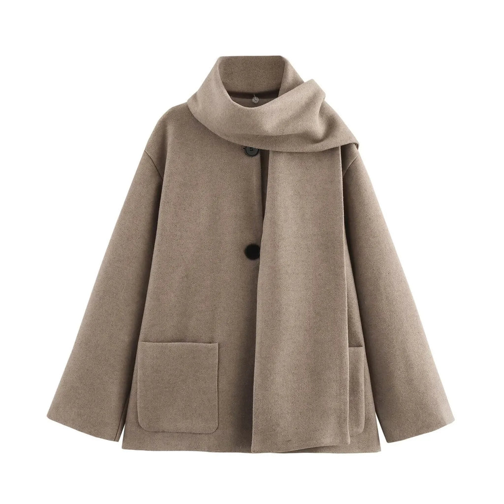 Long grey women's polyester overcoat with a black faux fur collar on a hanger.