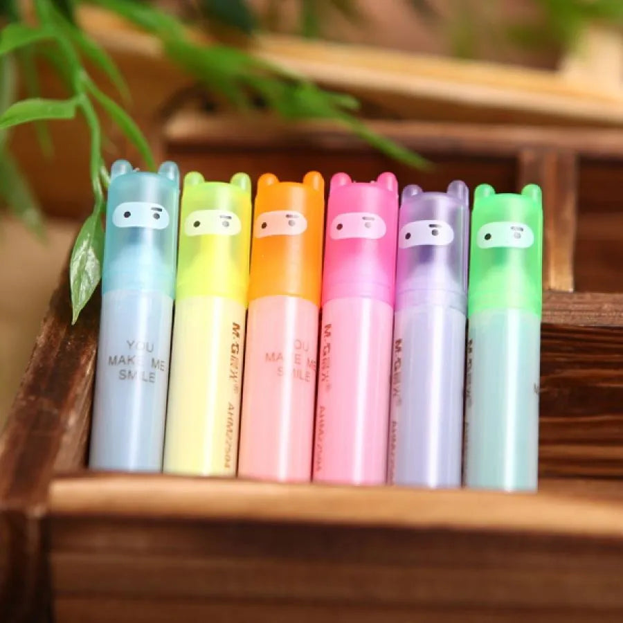 Six plastic highlighter pens with oblique tips in six different colours, presented in a bagged pack.