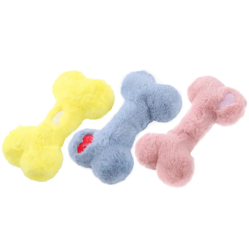 Bone-shaped plush dog toy with hearts and 'Love' text, containing squeaker for interactive pet play