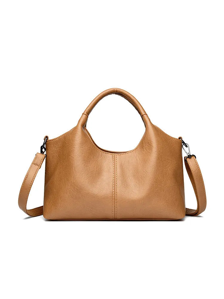 Genuine leather women's crossbody bag in beige colour showing large capacity design