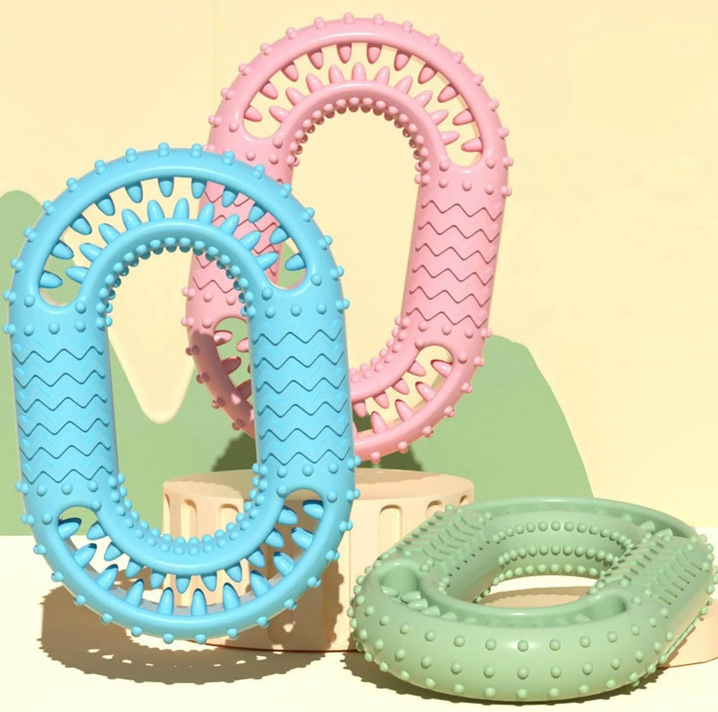 Blue O-ring shaped dog chew toy for aggressive chewers and dental care on a white background.