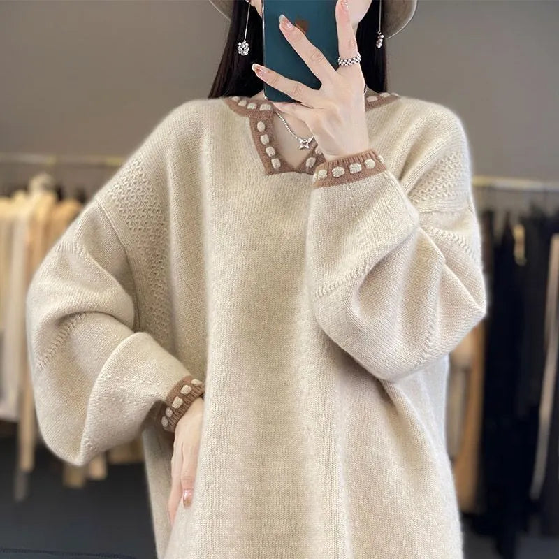 Women's camel coloured V-neck pullover sweater with long sleeves on hanger