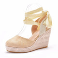 Women's apricot bohemian wedge sandals with bead and tassel details on a buckle-fastened PU upper.