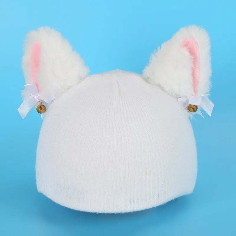 Plush cartoon-themed cover set on a medium motorcycle helmet with soft ear decorations.