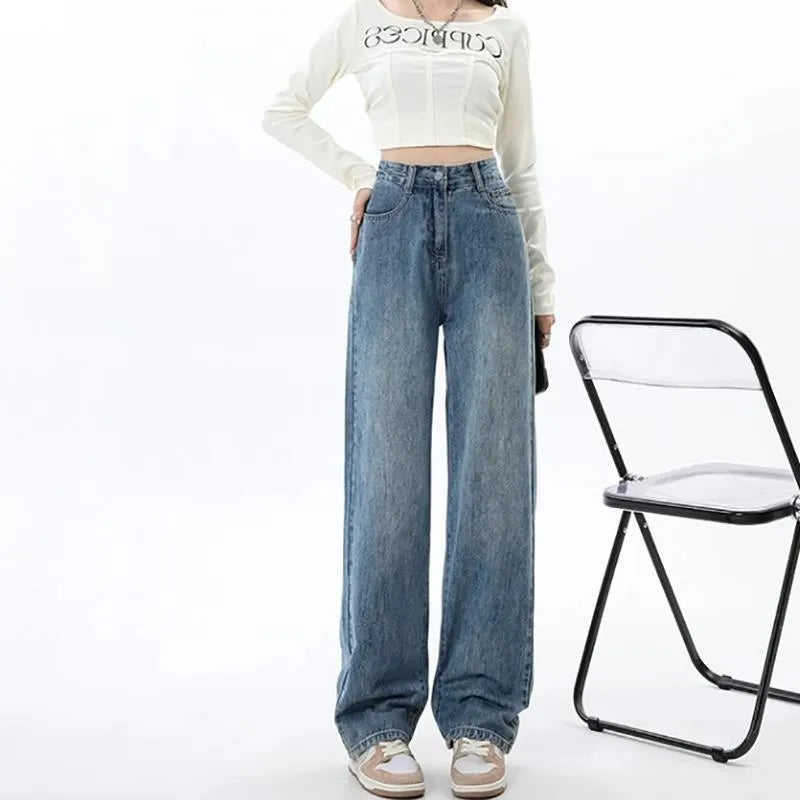 Women's retro blue high-waisted wide-leg jeans with a straight-leg cut on a hanger.
