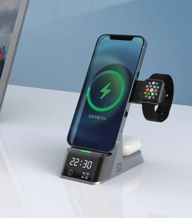 Black six-in-one alarm clock and wireless charging station on a desk.