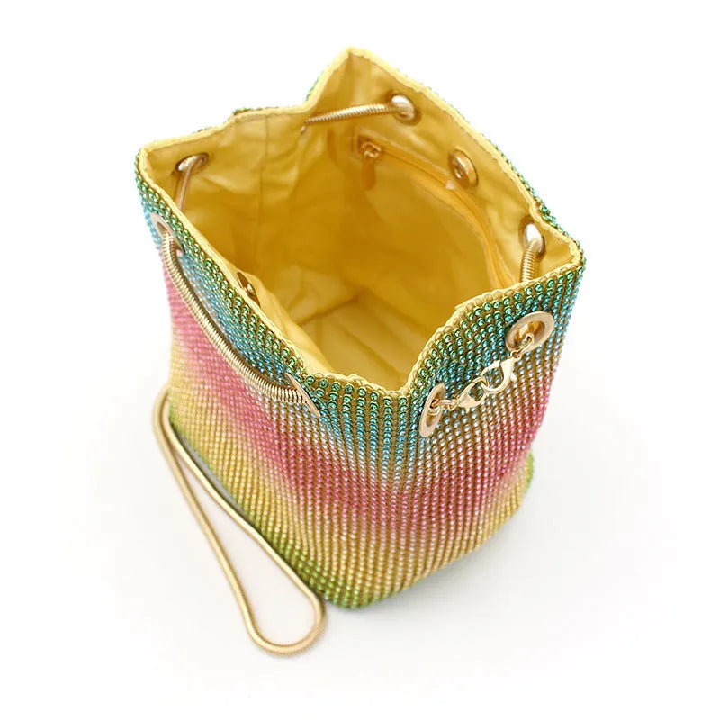 Rhinestone bucket bag in net red rainbow colours with a sparkle texture and soft construction