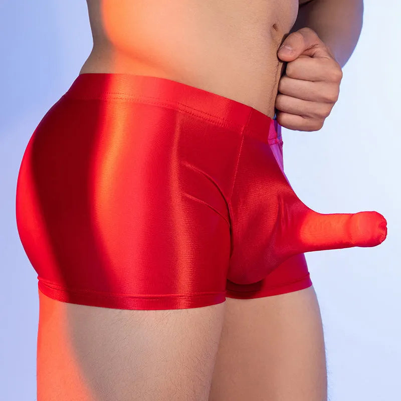 Men's seamless nylon boxer shorts in red with an elephant nose pattern, showing mid-waist fit.
