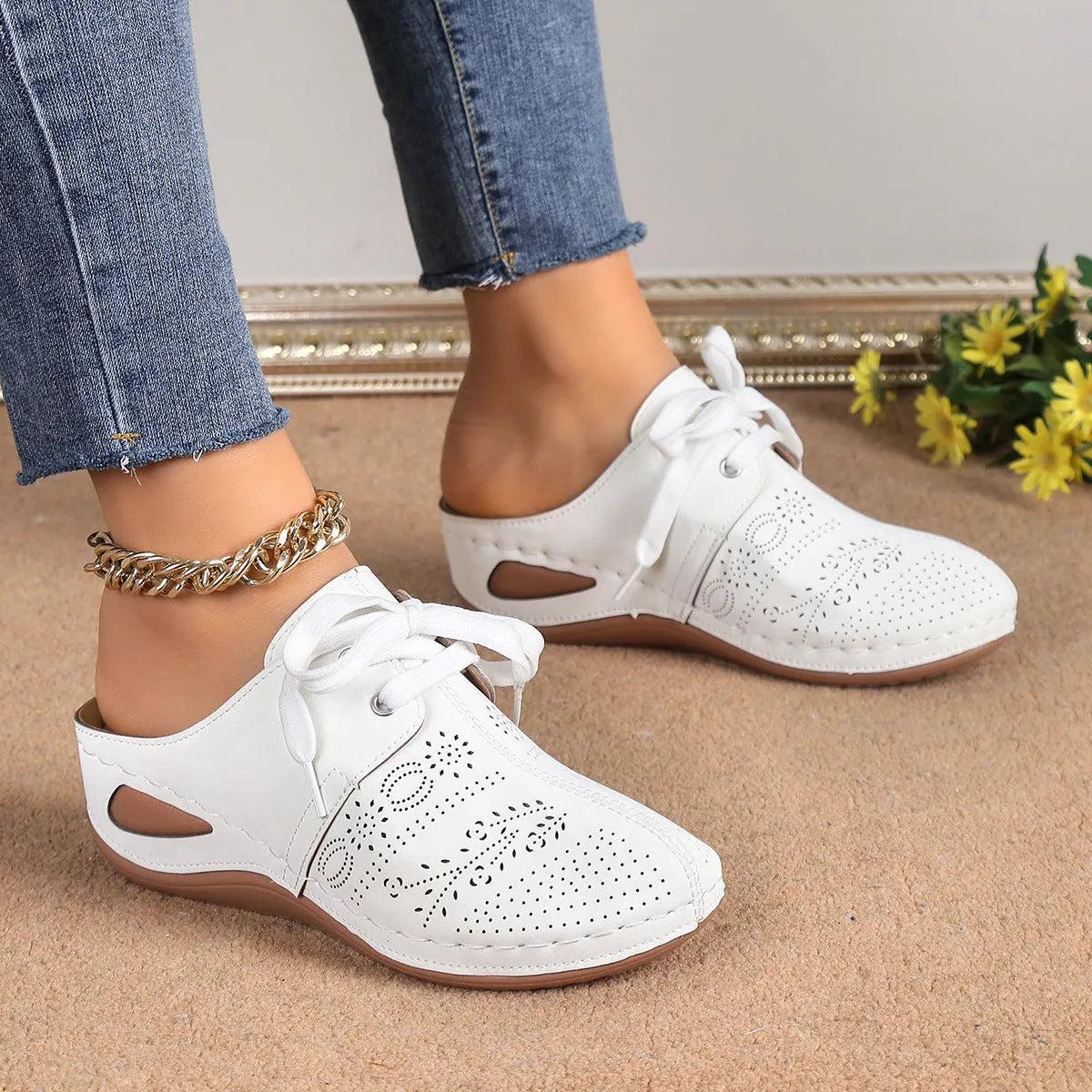 Women's suede lace-up wedge sandals in light grey showing hollow-out design and rubber sole