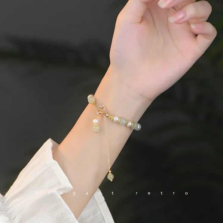 Women's Hetian jade bracelet with round pearl pendant and gold electroplated metal links