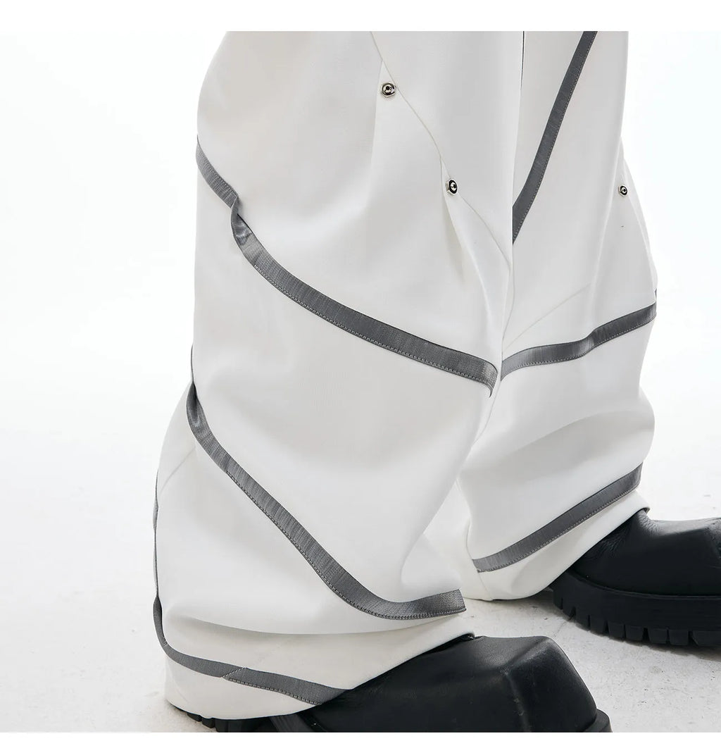 Men's polyester trousers with three-dimensional cutting, metal striped rivets, and pleated design in black or white