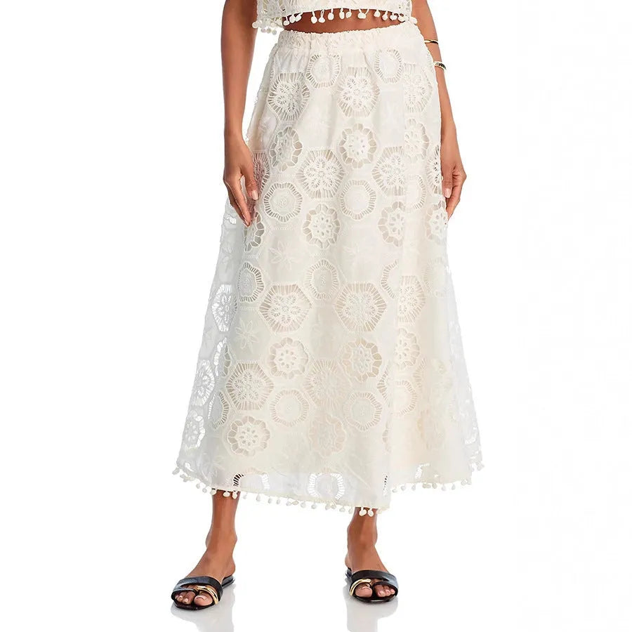 White women's retro co-ord suit with sleeveless top and embroidered long skirt