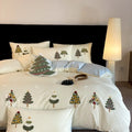 Cream blue cotton bedding set with embroidered Christmas tree and flowers on duvet cover.