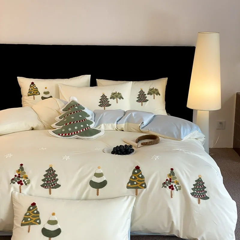 Cream blue cotton bedding set with embroidered Christmas tree and flowers on duvet cover.