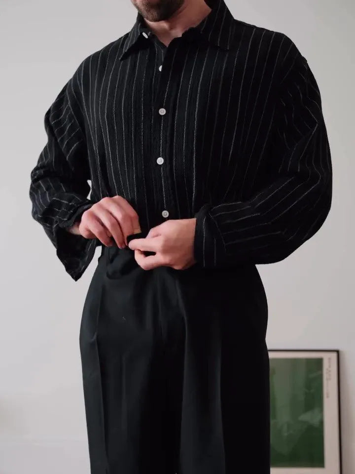 Black pinstriped button-down polyester shirt with regular fit on hanger