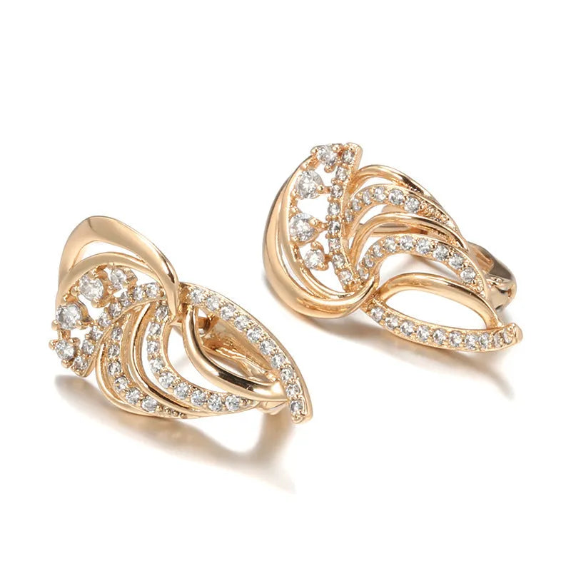 Gold geometric wing-shaped ear clips with micro inlaid stones on U-shaped copper clips